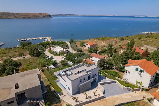 Aerial view over the coastline and coves around the villa
