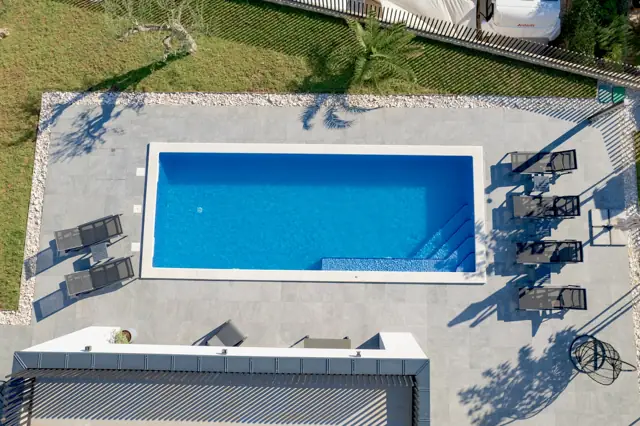 Top-down aerial view of the heated private pool